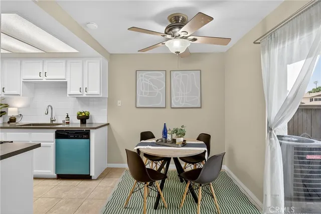 a kitchen with a dining table and chairs
