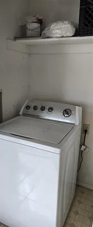 a utility room with washer and dryer