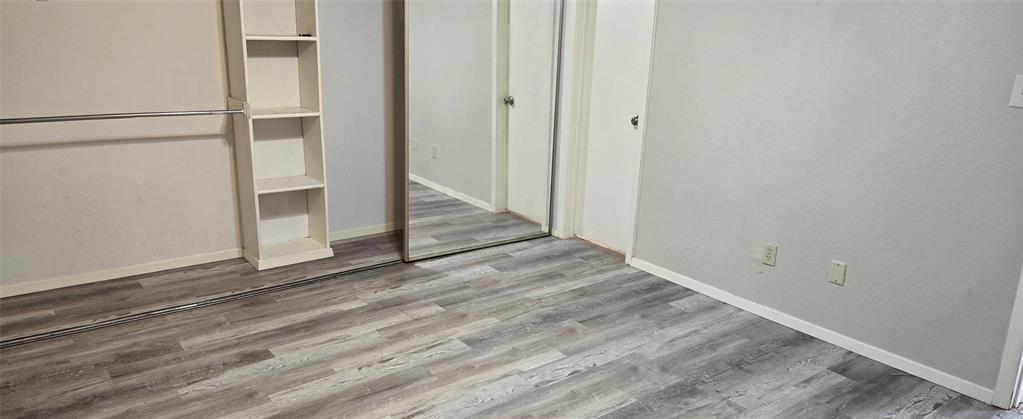 9601 Walnut Street, Unit 5104 Dallas, TX 75243 - Photo 13 of 20 a view of a small space with wooden floor