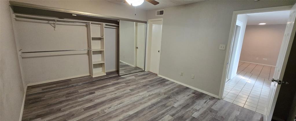 9601 Walnut Street, Unit 5104 Dallas, TX 75243 - Photo 15 of 20 a view of empty room with wooden floor