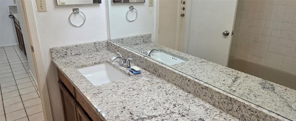 9601 Walnut Street, Unit 5104 Dallas, TX 75243 - Photo 17 of 20 a view of bathroom with a granite countertop sink