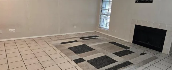 a view of an empty room with windows