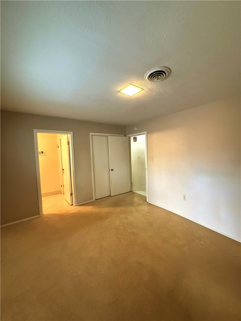 1118 Lincoln Street Alice, TX 78332 - Photo 15 of 32 an empty room with a empty space and windows