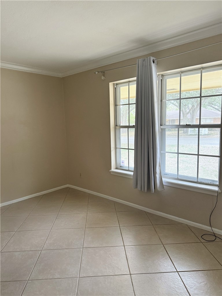 1118 Lincoln Street Alice, TX 78332 - Photo 2 of 32 a view of an empty room with a window