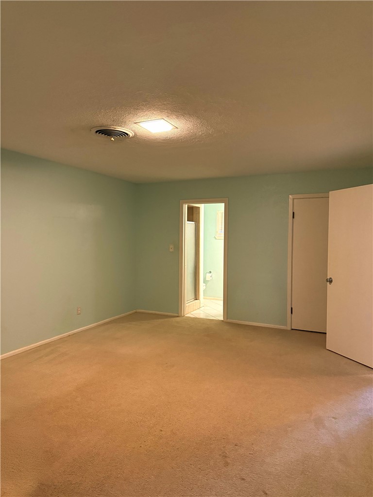 1118 Lincoln Street Alice, TX 78332 - Photo 25 of 32 a view of an empty room with a window