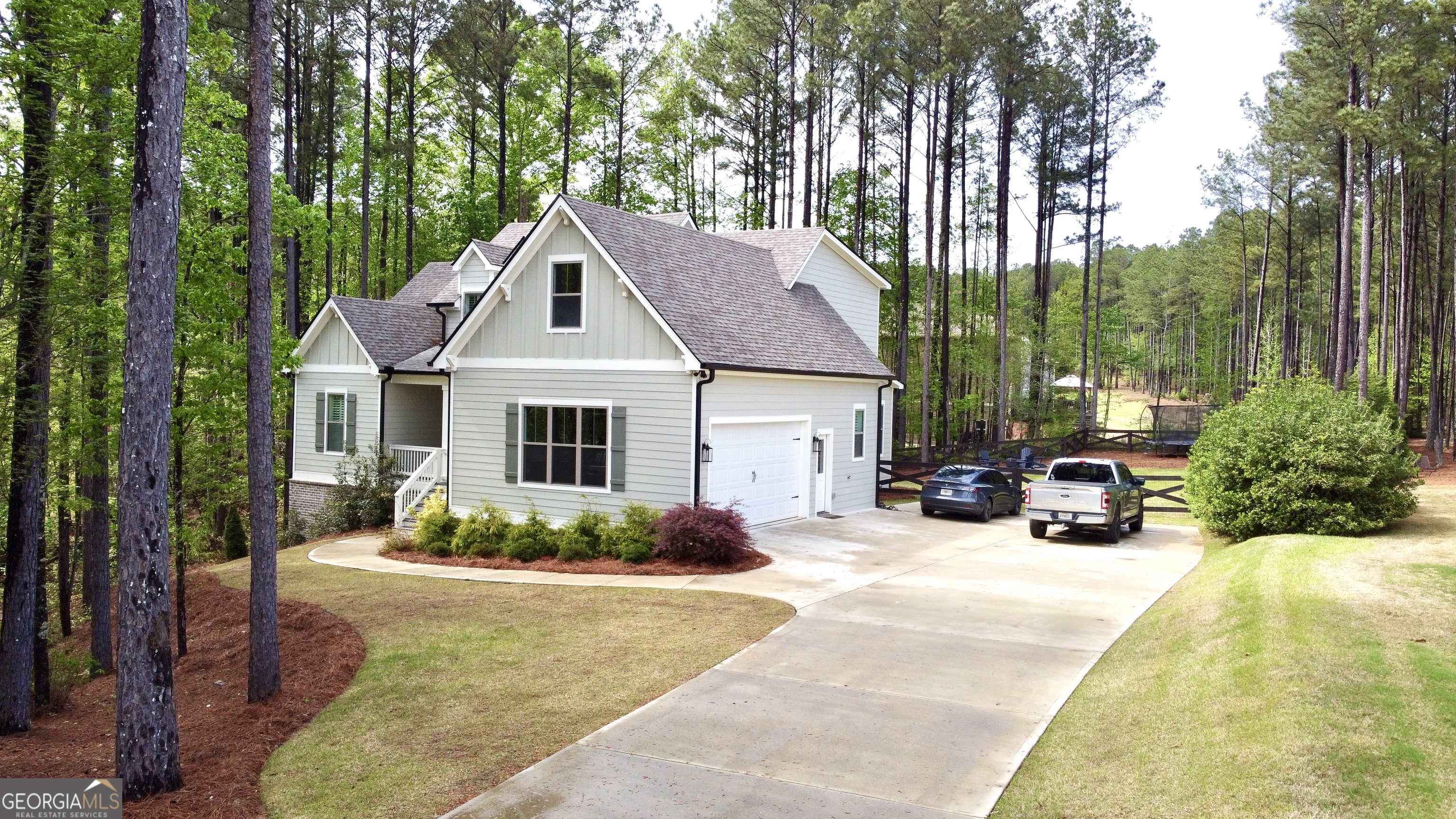 120 Spring Creek Drive Rutledge, GA 30663 - Photo 38 of 38 a view of a house with sitting area and garden