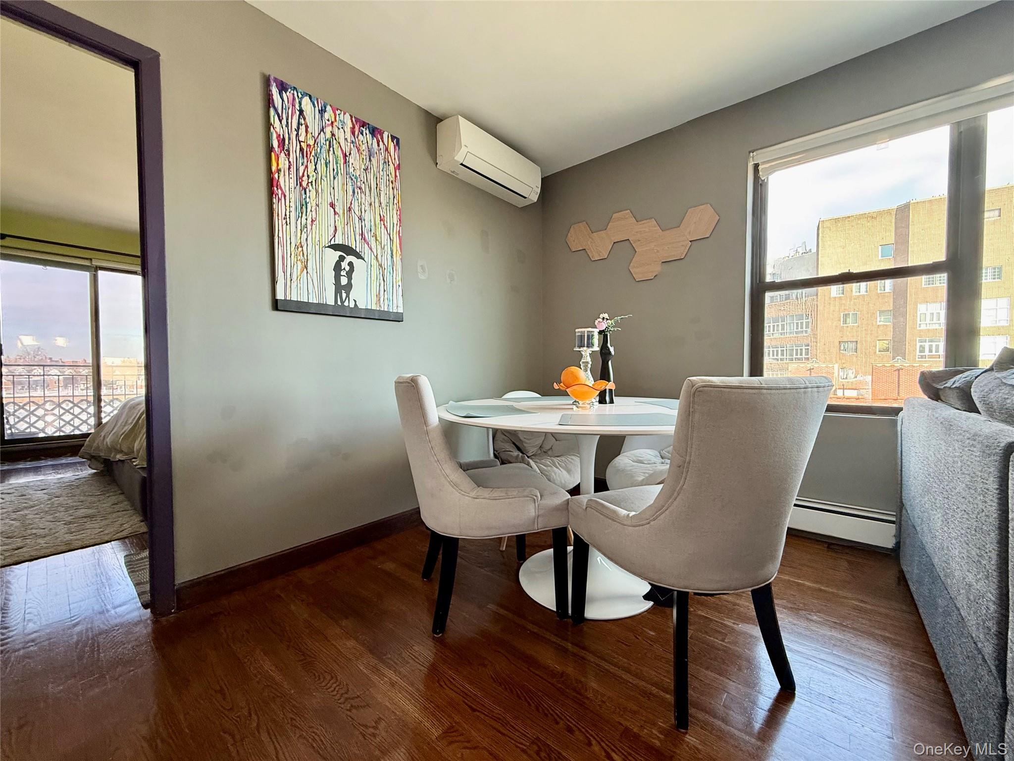 87-14 57th Road, Unit 5A Queens, NY 11373 - Photo 15 of 34 a dining room with furniture and wooden floor