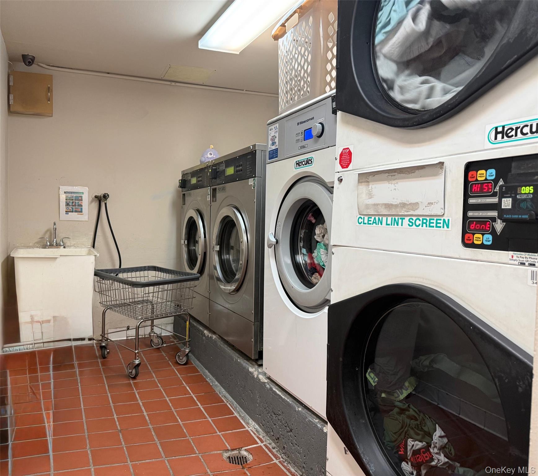 87-14 57th Road, Unit 5A Queens, NY 11373 - Photo 24 of 34 a utility room with dryer and washer