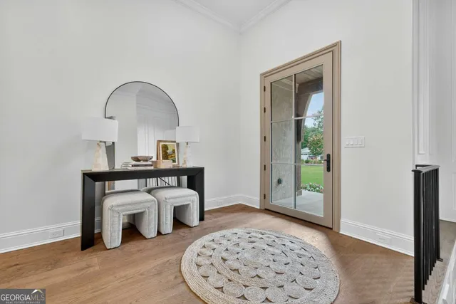 a living room with furniture chandelier and fireplace