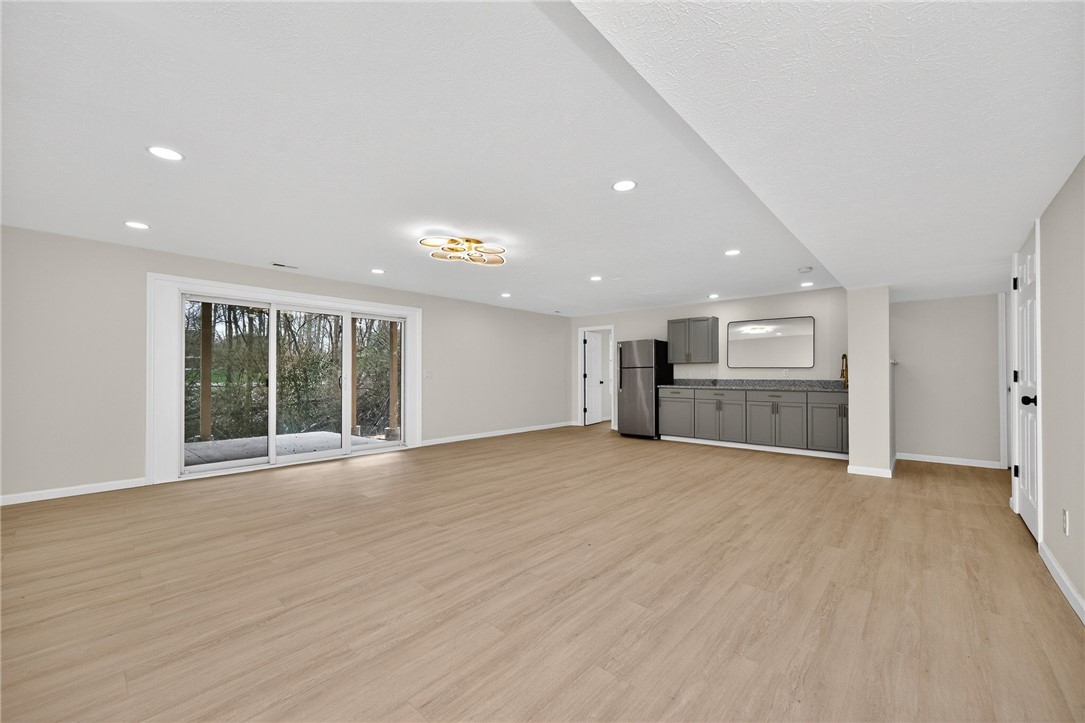811 Wind Bluff Point Springboro, OH 45066 - Photo 35 of 51 This spacious area features modern flooring and a convenient kitchenette, perfect for entertainment or a comfortable living space.
