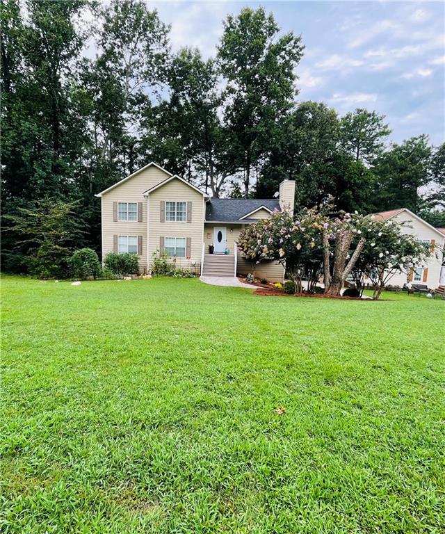 511 Queensbury Way Acworth, GA 30102 - Photo 1 of 1 a view of a house with a yard and large trees