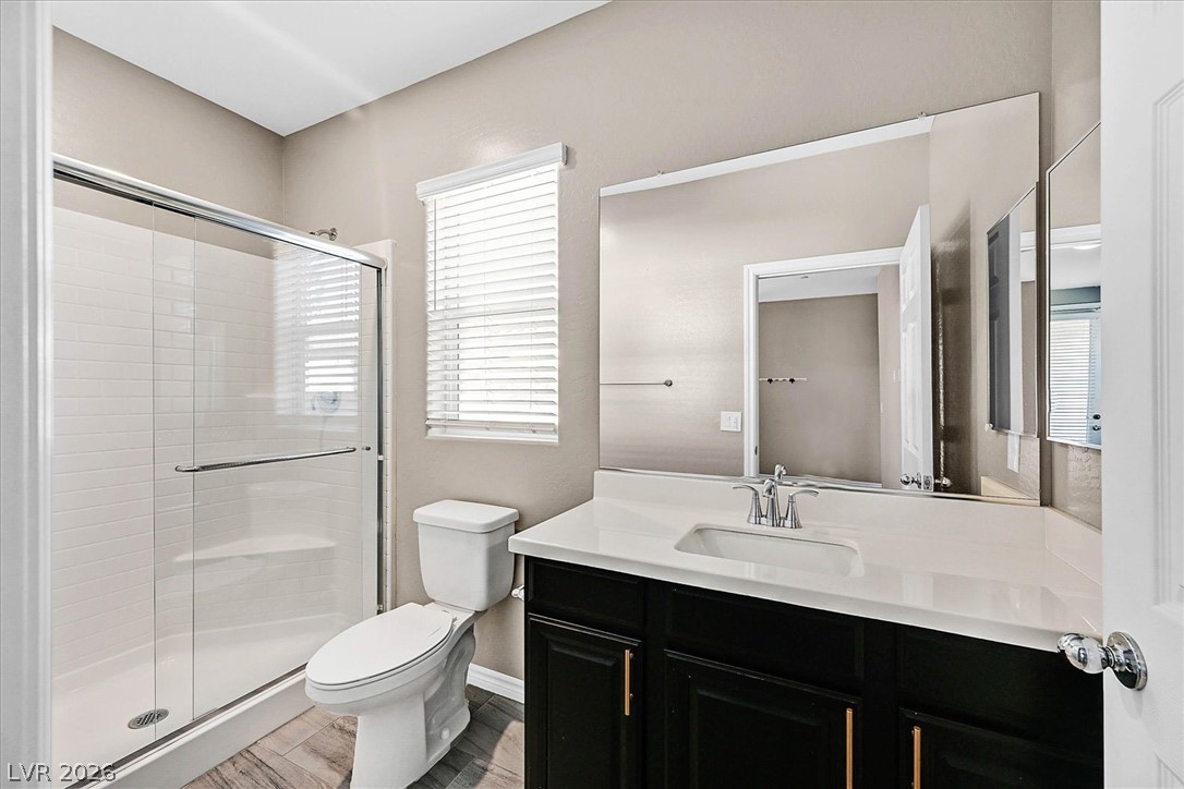 1106 Langston Ranch Avenue Henderson, NV 89002 - Photo 32 of 36 A well-appointed bathroom features a modern vanity with ample counter space and a spacious shower.