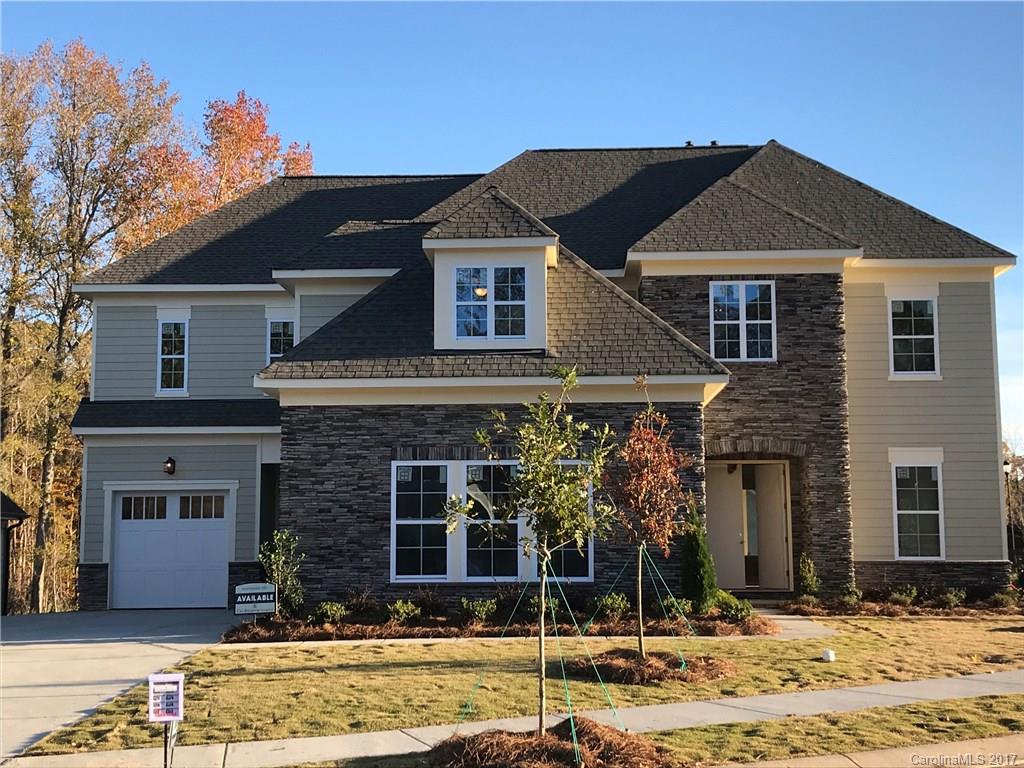 1342 Afton Way, Unit 121 Fort Mill, SC 29708 - Photo 1 of 12 a front view of a house with garden