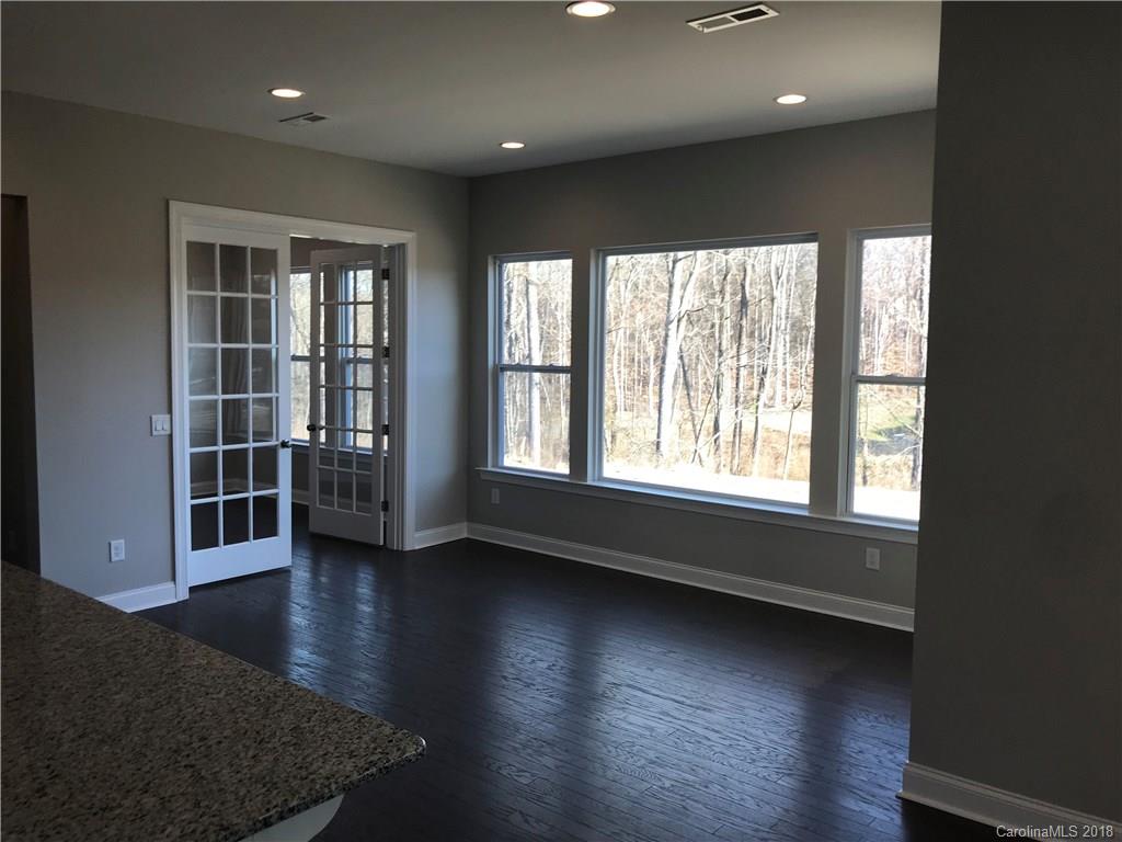 1342 Afton Way, Unit 121 Fort Mill, SC 29708 - Photo 6 of 12 an empty room with wooden floor and windows
