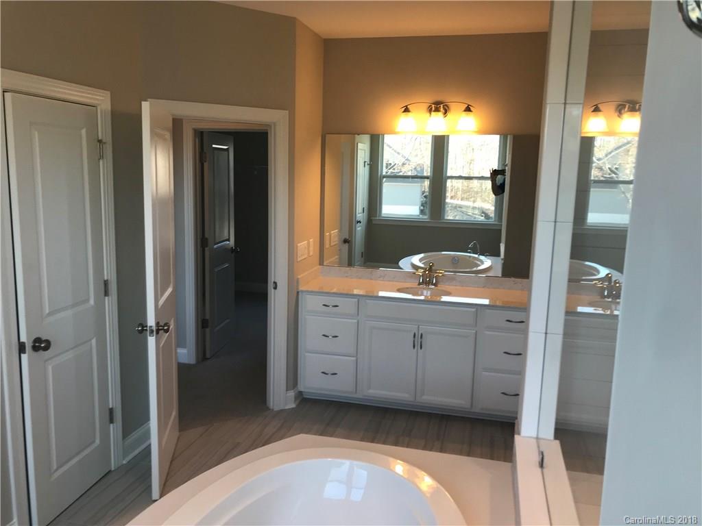 1342 Afton Way, Unit 121 Fort Mill, SC 29708 - Photo 7 of 12 a bathroom with a sink and a mirror