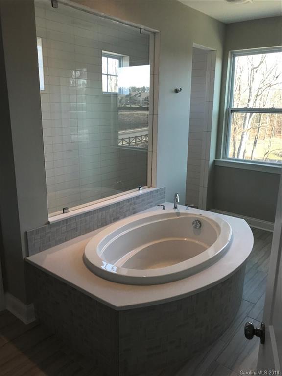 1342 Afton Way, Unit 121 Fort Mill, SC 29708 - Photo 8 of 12 a bathroom with a sink and a bathtub