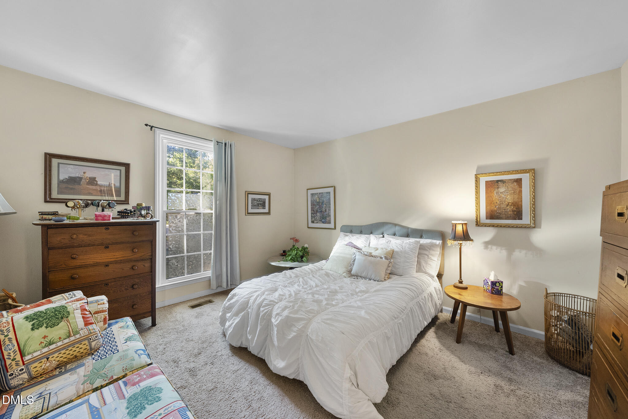 4424 Tetbury Place Raleigh, NC 27613 - Photo 12 of 27 a bedroom with a bed and furniture