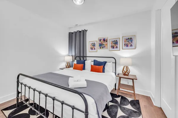 a bedroom with a bed and a window