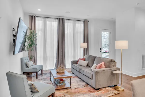 a living room with furniture and a large window