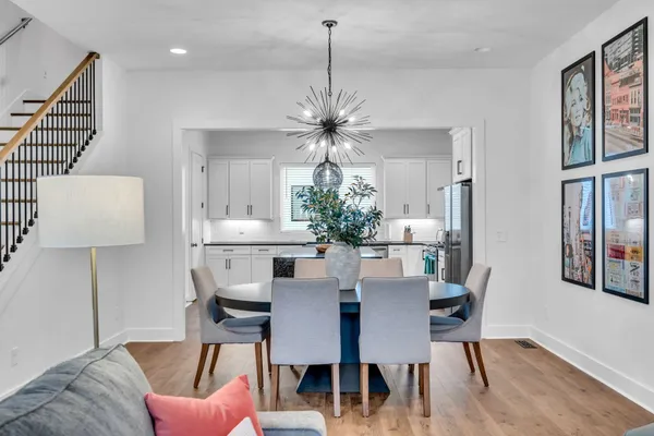 a dining room with furniture and window
