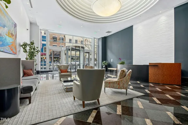 a roof deck with a table and chairs