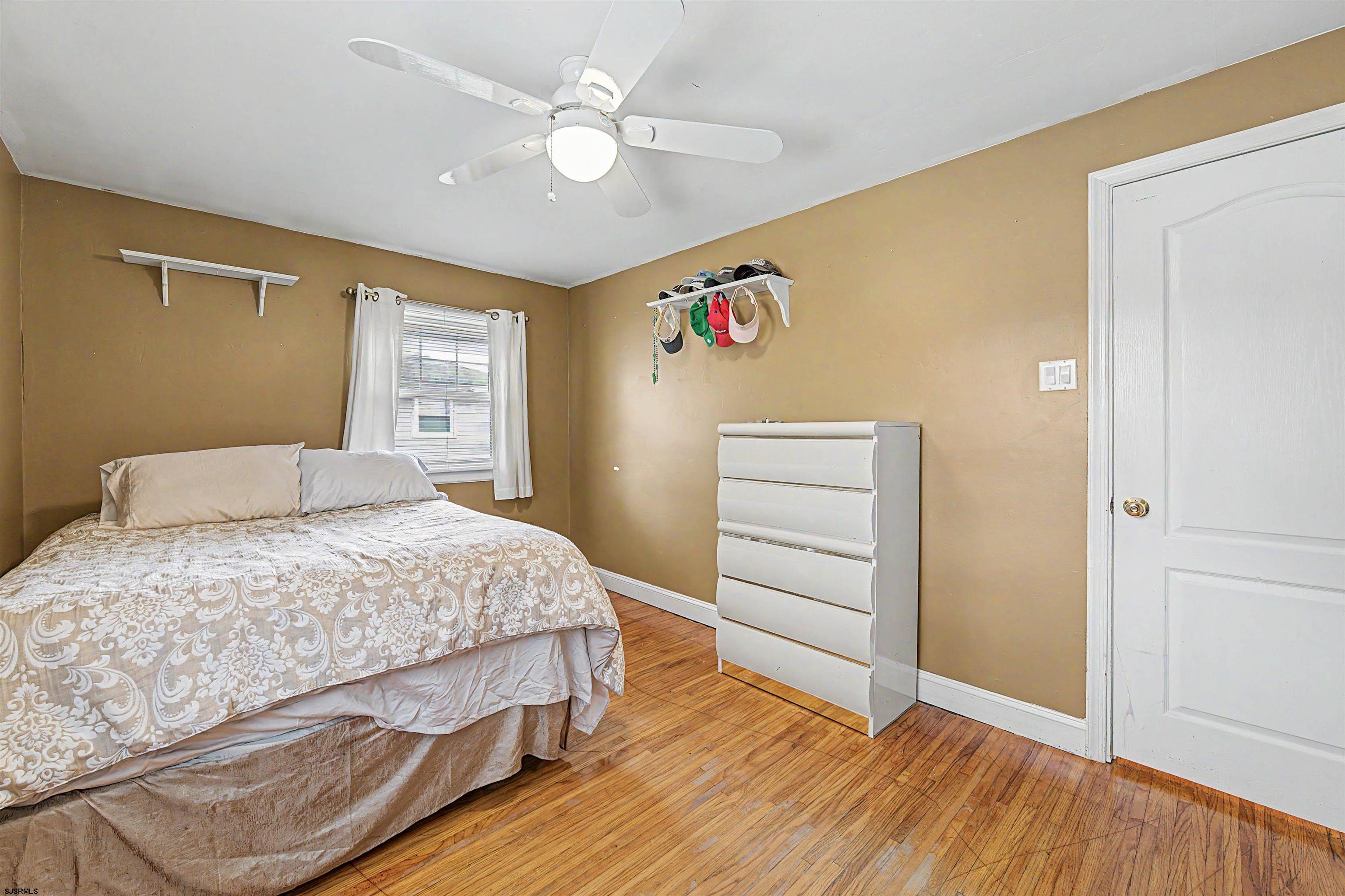 125 Exton Road Somers Point, NJ 08244 - Photo 22 of 35 a bedroom with a bed and a dresser