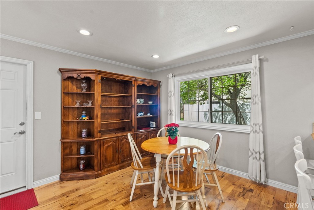 26450 Ridge Vale Drive Newhall, CA 91321 - Photo 12 of 40 a view of a dining room with furniture and a window