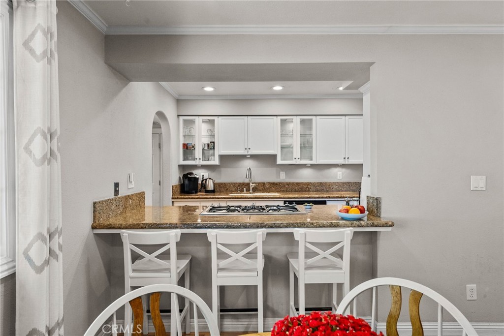 26450 Ridge Vale Drive Newhall, CA 91321 - Photo 14 of 40 a kitchen with a stove a sink and a refrigerator