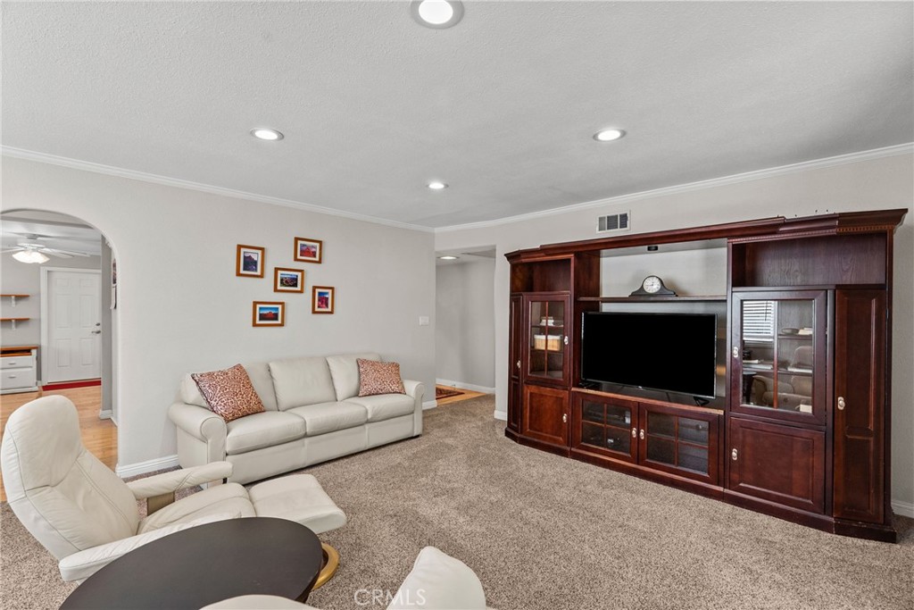 26450 Ridge Vale Drive Newhall, CA 91321 - Photo 19 of 40 a living room with furniture and a flat screen tv