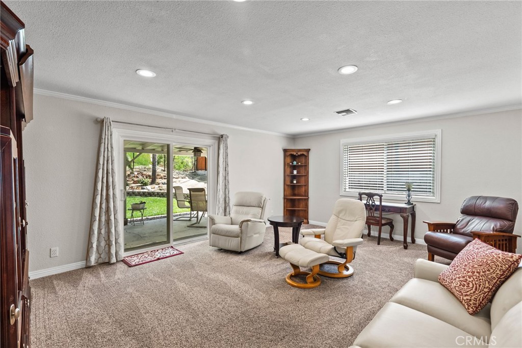 26450 Ridge Vale Drive Newhall, CA 91321 - Photo 20 of 40 a living room with furniture and a large window