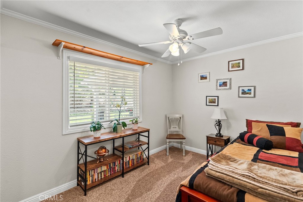 26450 Ridge Vale Drive Newhall, CA 91321 - Photo 22 of 40 a bedroom with furniture and a window