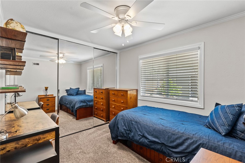 26450 Ridge Vale Drive Newhall, CA 91321 - Photo 24 of 40 a bedroom with a bed a couch and a dresser