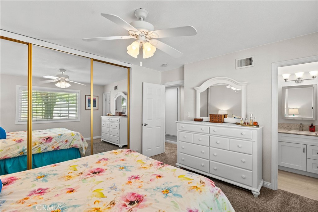 26450 Ridge Vale Drive Newhall, CA 91321 - Photo 26 of 40 a bed room with a bed a dresser and mirror