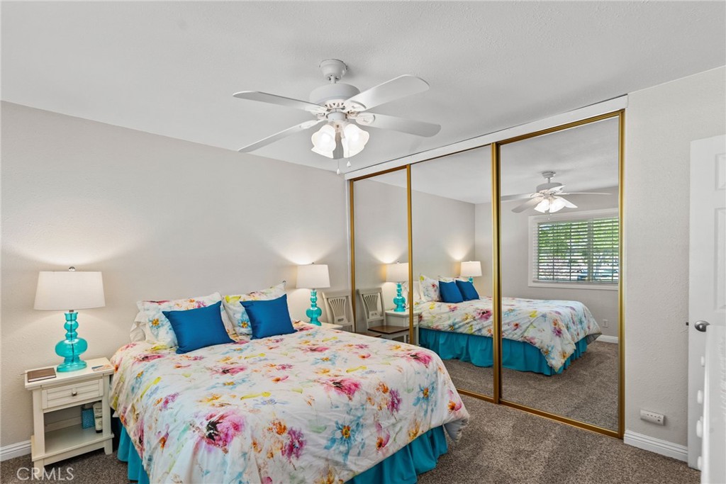 26450 Ridge Vale Drive Newhall, CA 91321 - Photo 29 of 40 a bedroom with a bed and a chandelier