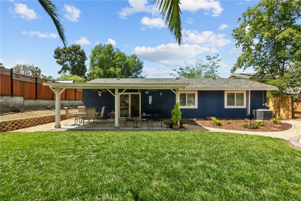 26450 Ridge Vale Drive Newhall, CA 91321 - Photo 34 of 40 a front view of a house with garden and patio