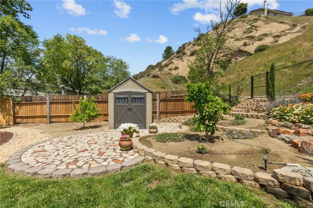 26450 Ridge Vale Drive Newhall, CA 91321 - Photo 35 of 40 a front view of a house with a yard