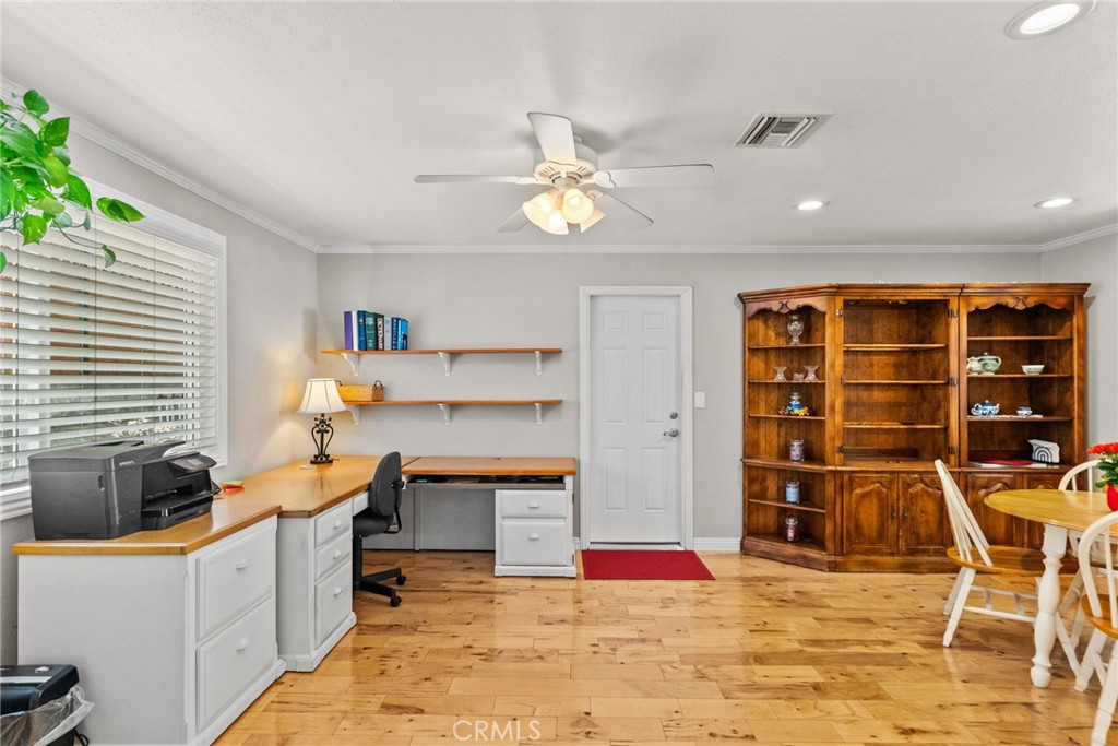 26450 Ridge Vale Drive Newhall, CA 91321 - Photo 10 of 40 a view of a workspace with furniture and a kitchen