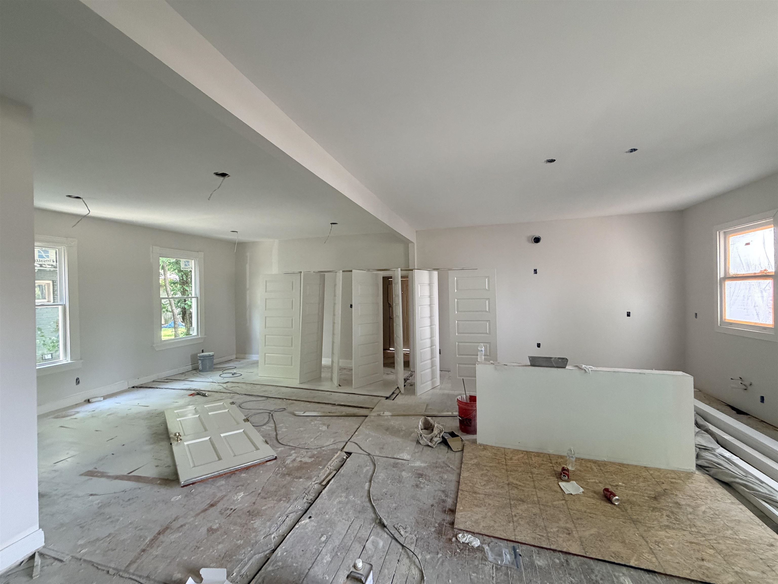 961 Meda Street Memphis, TN 38104 - Photo 23 of 27 Spacious room featuring multiple windows, white walls, and an open layout