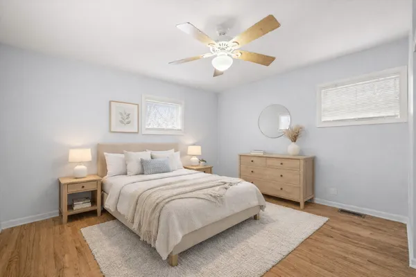 a bedroom with a bed and a dresser