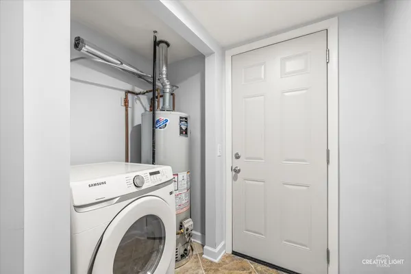 a view of entryway with washer and dryer