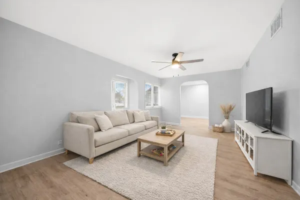 a living room with furniture and a flat screen tv