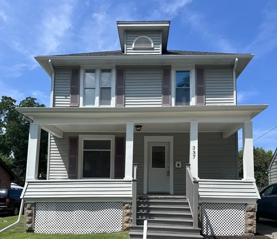 a view of a house with a door and a porch