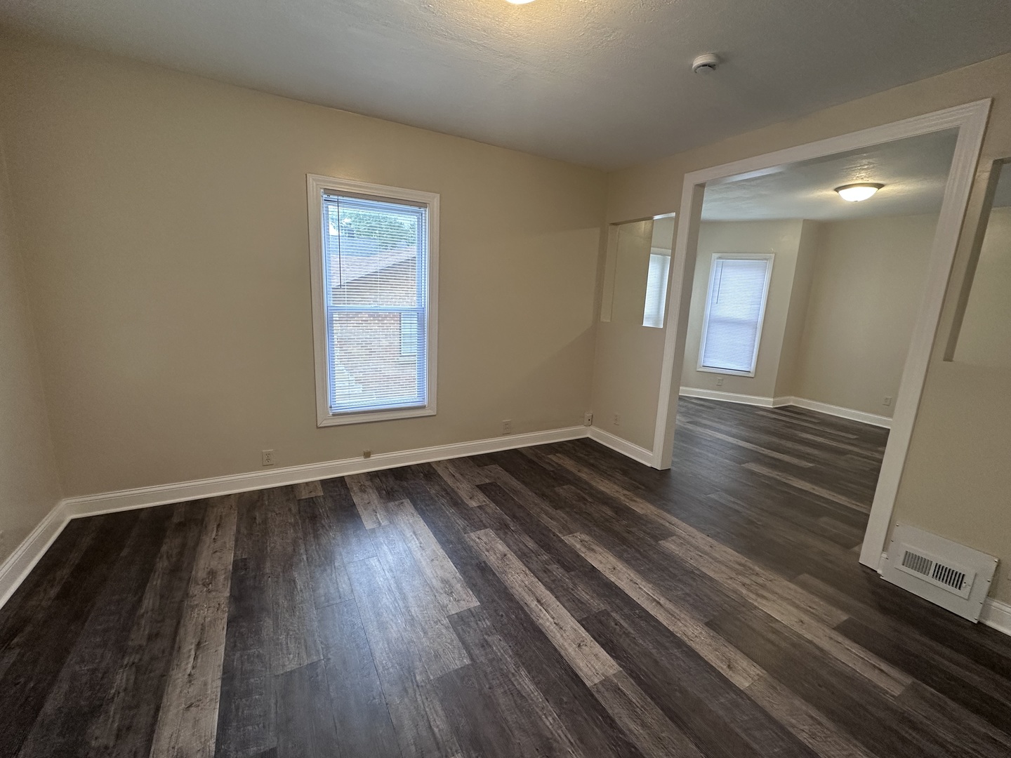 337 South Fordham Avenue Aurora, IL 60506 - Photo 2 of 10 wooden floor in an empty room with a window