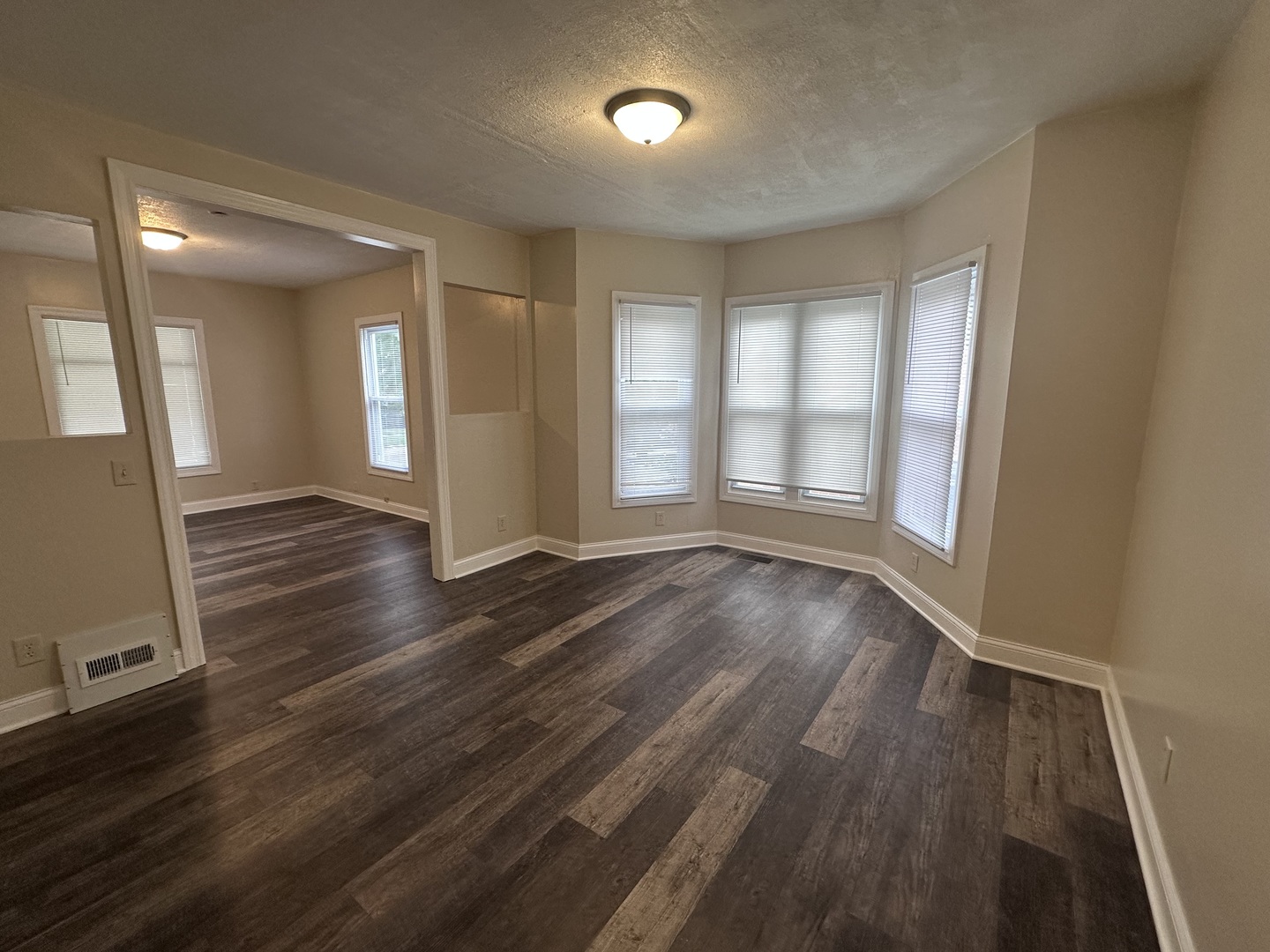 337 South Fordham Avenue Aurora, IL 60506 - Photo 3 of 10 wooden floor in an empty room with a window