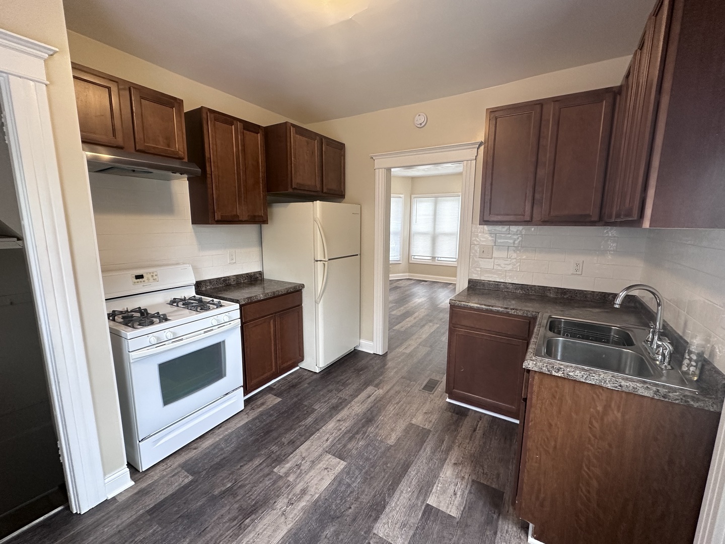 337 South Fordham Avenue Aurora, IL 60506 - Photo 4 of 10 a kitchen with wooden cabinets and stainless steel appliances