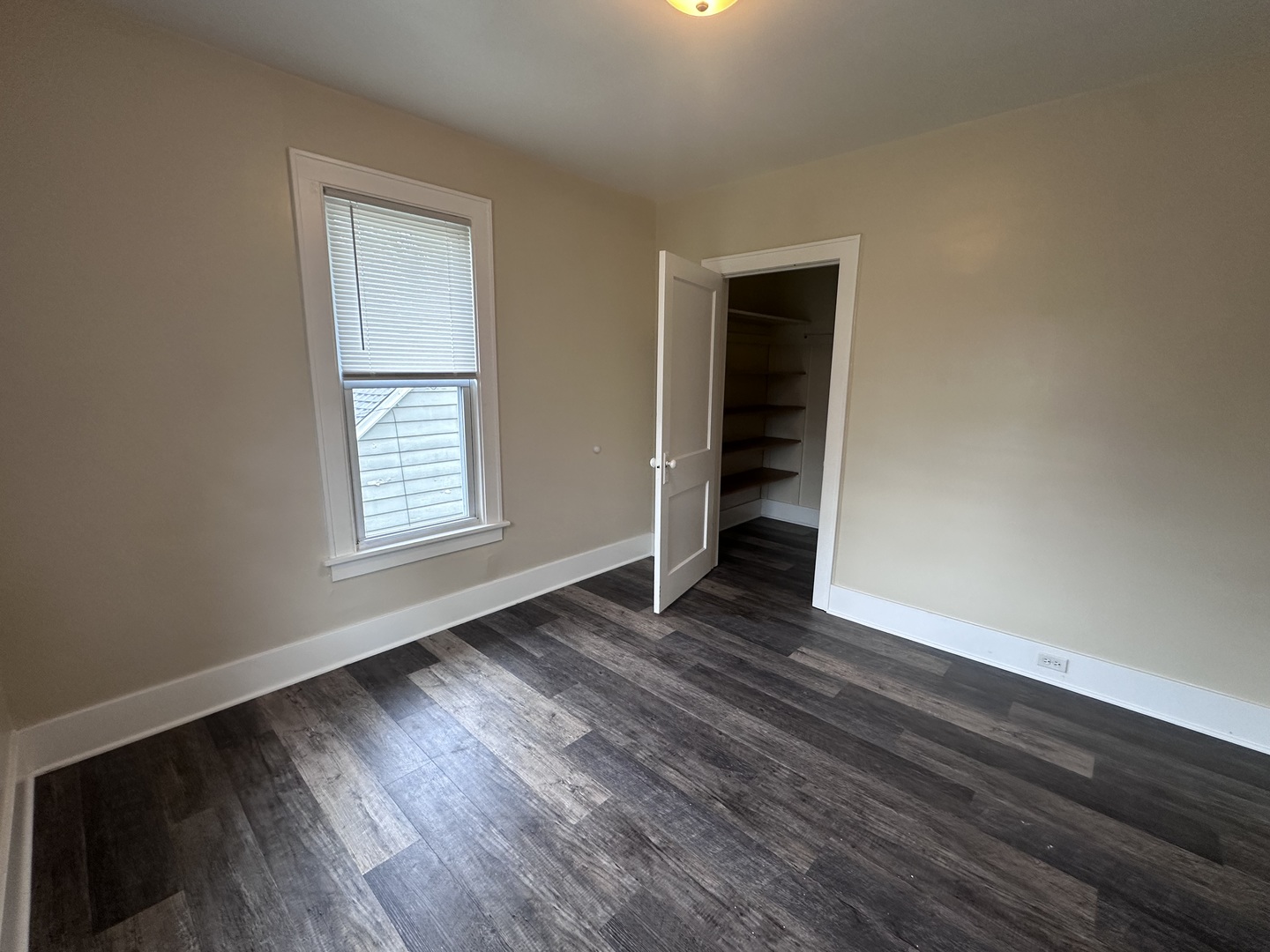 337 South Fordham Avenue Aurora, IL 60506 - Photo 9 of 10 an empty room with wooden floor closet and windows