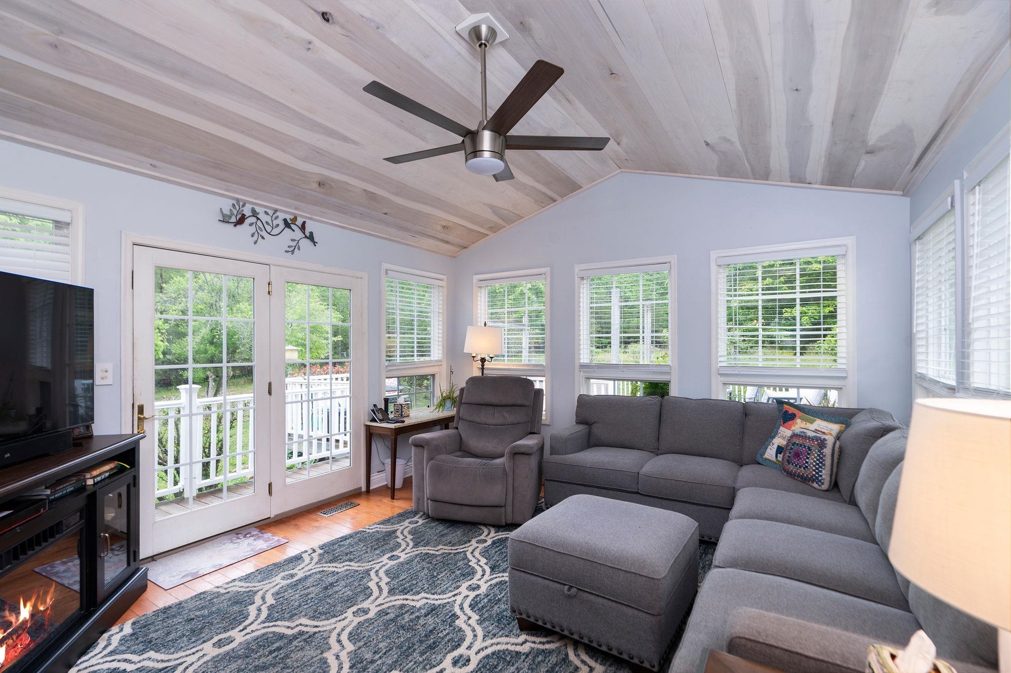 516 Estaline Valley Road Craigsville, VA 24430 - Photo 16 of 75 a living room with furniture a flat screen tv and a window