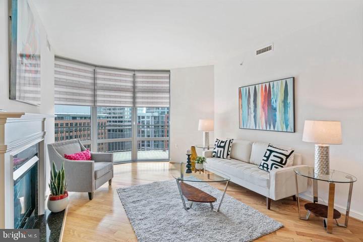 11990 Market Street, Unit 1311 Reston, VA 20190 - Photo 15 of 59 a living room with furniture and a potted plant
