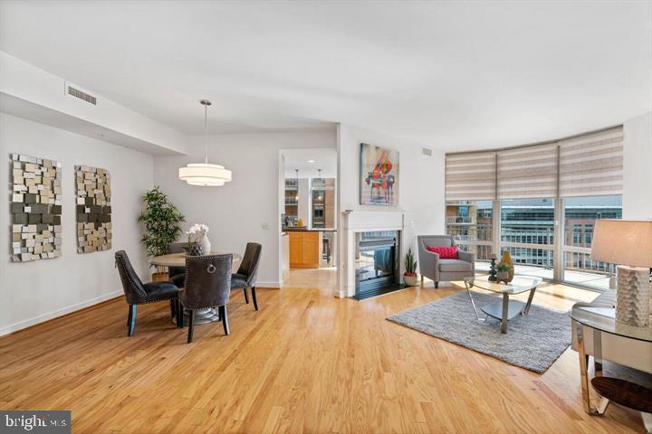 11990 Market Street, Unit 1311 Reston, VA 20190 - Photo 16 of 59 a work room with furniture a rug and a large window