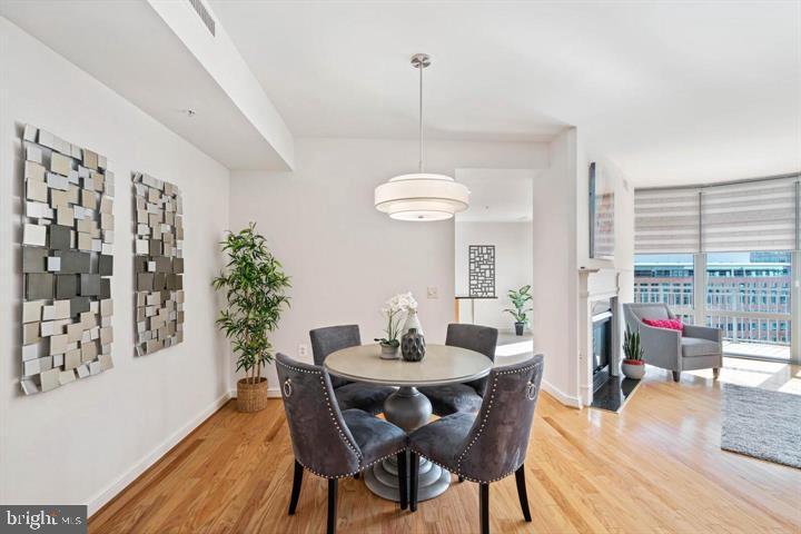 11990 Market Street, Unit 1311 Reston, VA 20190 - Photo 22 of 59 a dining room with furniture and window